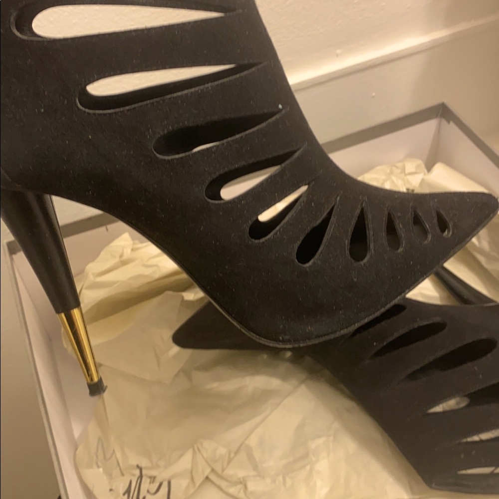 Black booties with gold heel. Giuseppe Zanotti